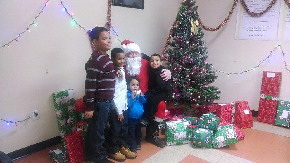 Santa Harry with clients children at Christmas event